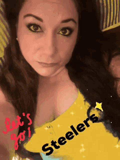 a woman wearing a yellow shirt that says steelers on it