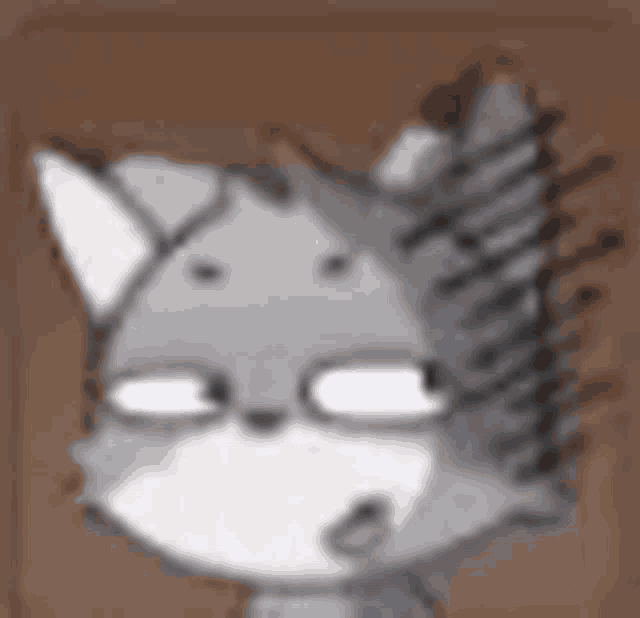 a close up of a cartoon cat 's face with glasses on .