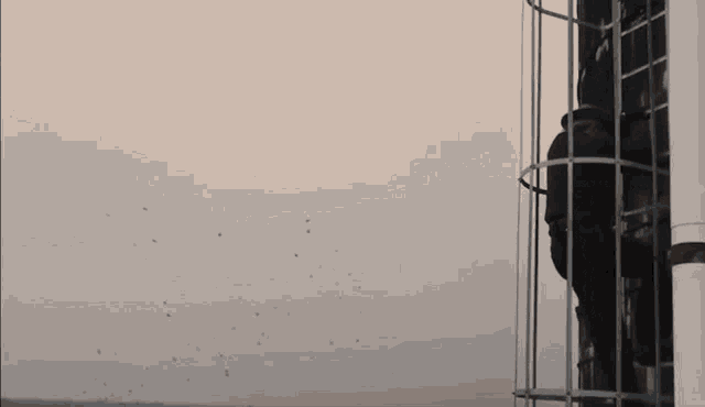 a man in a sheriff 's uniform is standing on a metal staircase