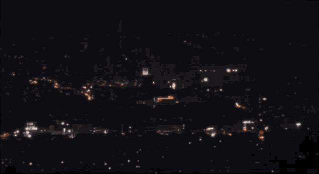 a blurred image of a city at night