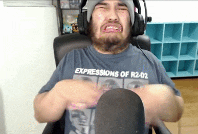 a man wearing headphones and a t-shirt that says expressions of r2d2