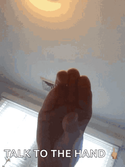 a picture of a hand with the words talk to the hand underneath it