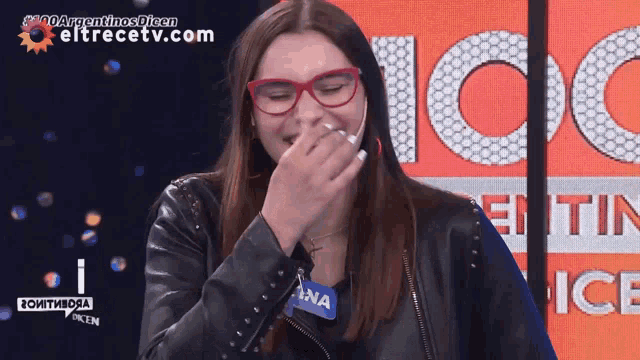 a woman wearing glasses and a name tag that says ana on it
