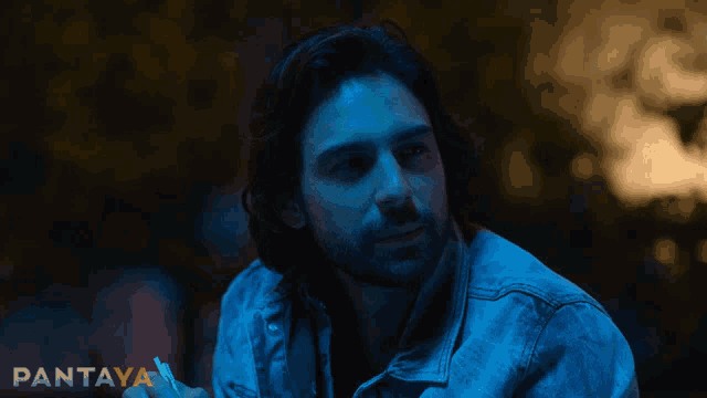 a man in a denim jacket is smiling with pantaya written on the bottom right