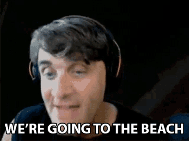 a man wearing headphones says we 're going to the beach .