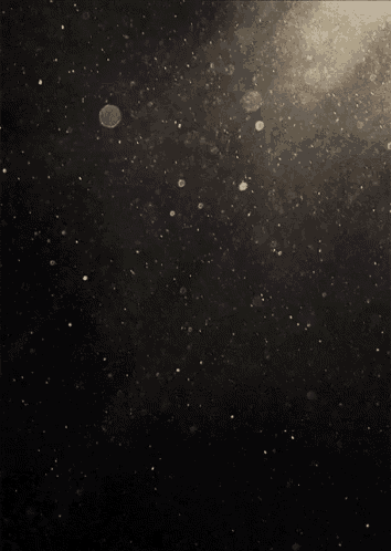 a black background with a lot of small circles on it
