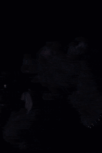 a close up of a person 's face with their fingers on their face .