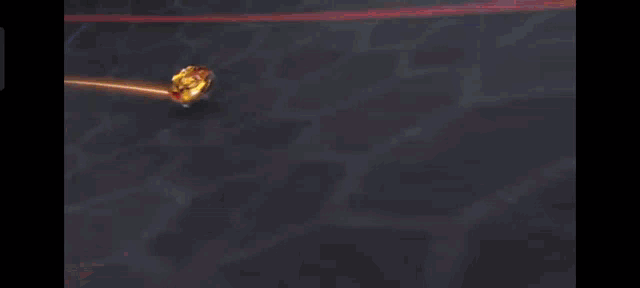 a close up of a toy car spinning on a track with a flame coming out of it .