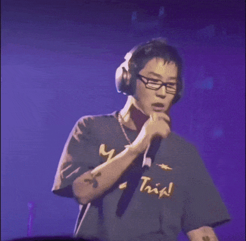 a man wearing headphones and a t-shirt that says " mars it 's a trip "