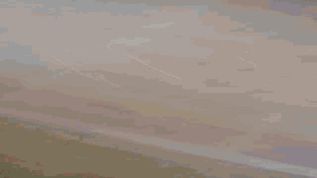 a blurred image of a red and blue object on a white surface