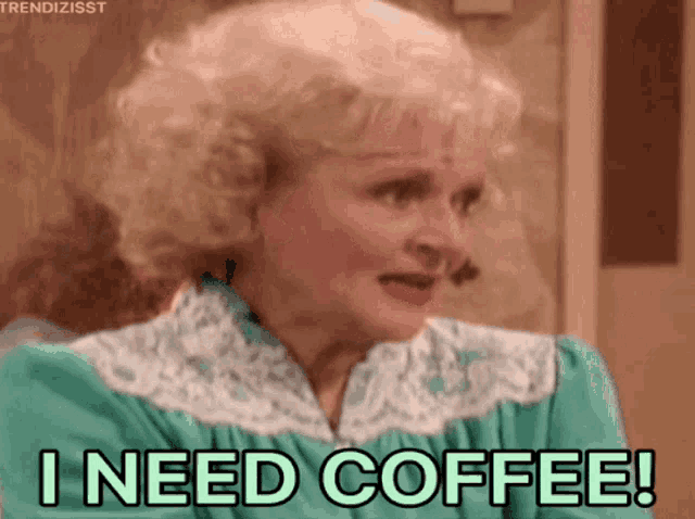 a woman says i need coffee in a green dress