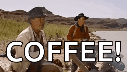 two men in cowboy hats are sitting next to each other on a rock in the desert with the words `` coffee ! ''