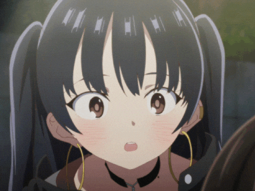 a close up of a girl 's face with a surprised look on her face