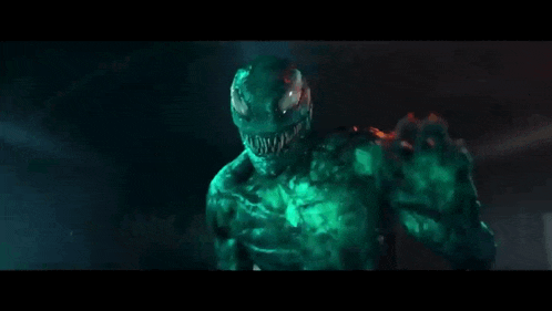 a green monster with the words " мы все в опасности " written on it