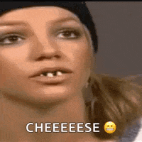 a close up of a woman 's face with a smiley face and the words `` cheese '' .