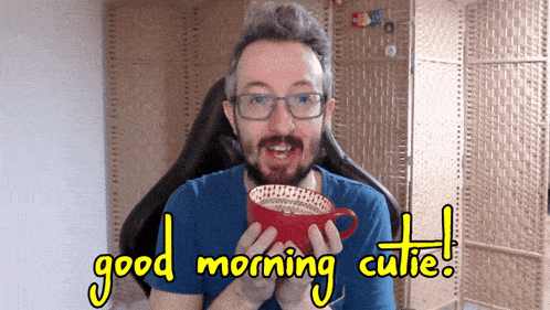 a man holding a cup of coffee with the words good morning cutie written on the bottom
