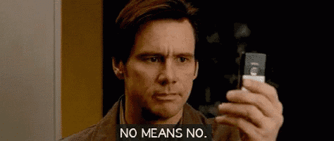a man is taking a picture of himself with a cell phone and says `` no means no '' .