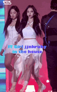 a woman in a white dress with the words " it girl jinkruby in the house " written on it