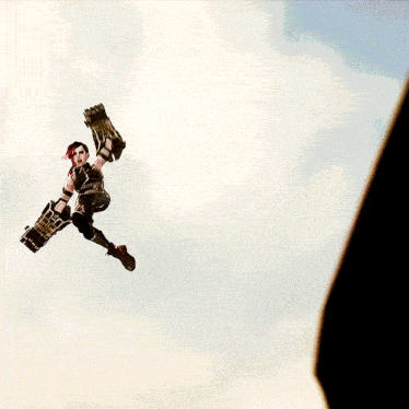 a person is flying through the air wearing a pair of jet packs