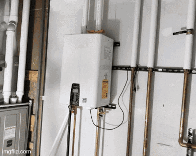 a white water heater with a sticker on it that says ' warning '