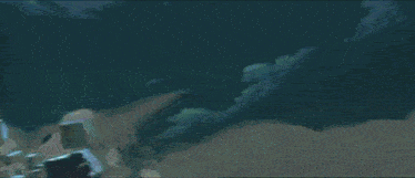 a woman in a white dress is standing in a dark room .