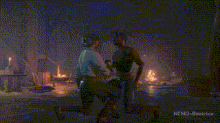 a man and a woman are looking at each other in a dark room with the words nemo-beatrice below them .