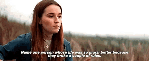 a woman is standing in a field with the words " name one person whose life was so much better because they broke a couple of