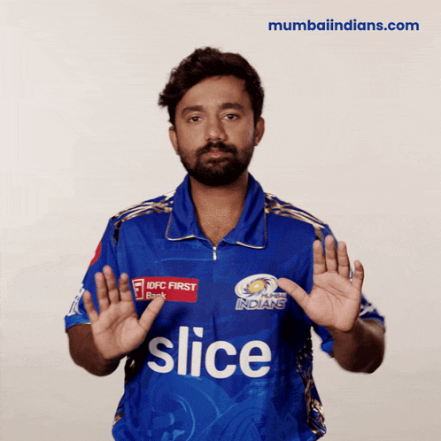 a man wearing a blue shirt that says slice on the front