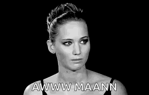a black and white photo of a woman with a sad look on her face and the words `` awww maann '' .