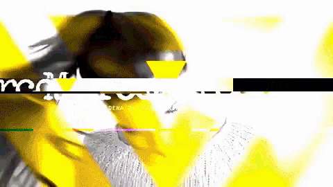 a blurry picture of a person with a yellow triangle in the middle