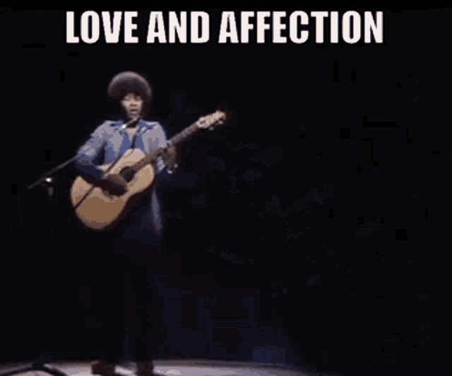 a man singing into a microphone while holding a guitar with the words love and affection above him