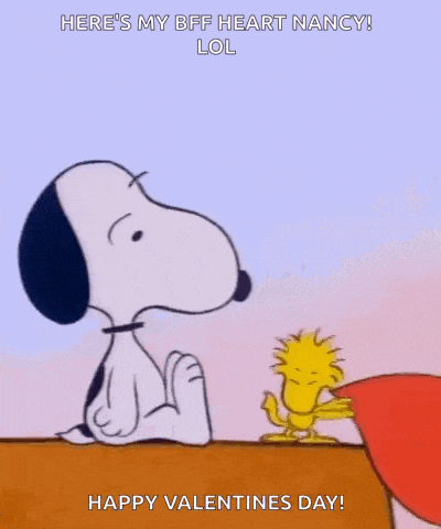 snoopy and woodstock are holding a heart in front of their face .