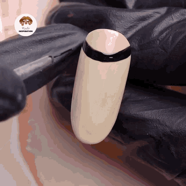 a close up of a nail with lipstick inspiration written on the corner
