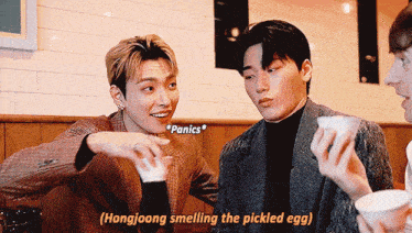 hongjoong smelling the pickled egg is written on the bottom of the screen