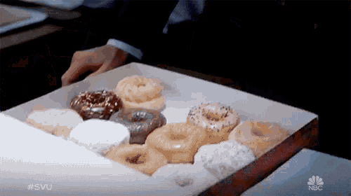 a box of donuts with the nbc logo on the bottom