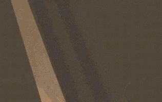 a close up of a staircase with a light hanging from it
