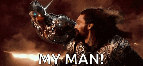 a man with a beard is fighting a robot with the words " my man " on the bottom