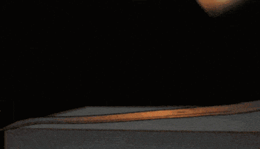 a close up of a person holding a piece of paper