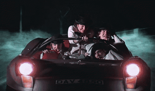 a group of people are riding in a car with the license plate dayasco