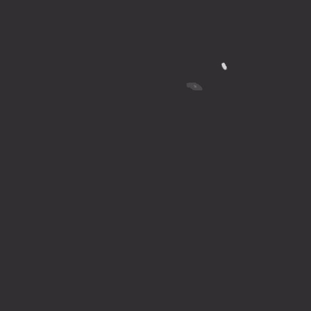 a black and white photo of a person 's hand behind a smokey background .