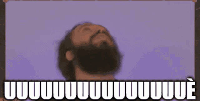 a man with a beard is looking up with a purple background and the words uuuuuuue behind him