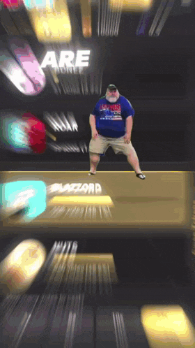 a blurry picture of a man dancing in front of a sign that says blizzard