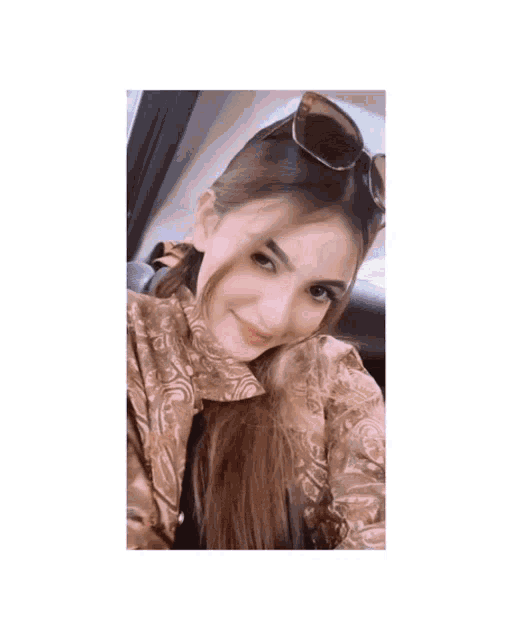 a woman wearing sunglasses looks up at something