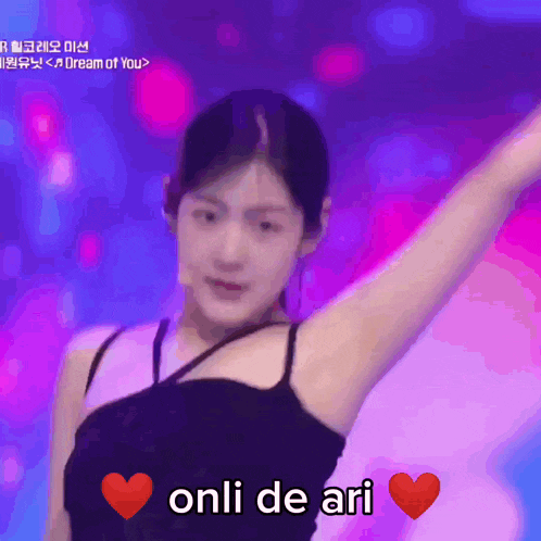 a woman in a black tank top with the words onli de ari on the bottom