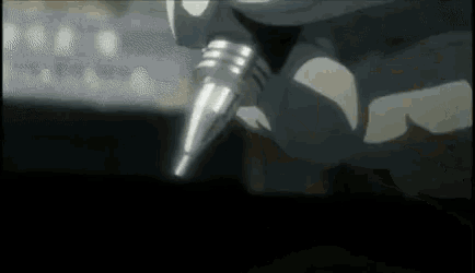 a close up of a person holding a microphone in their hand .