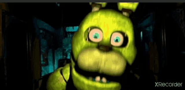 a yellow bunny from five nights at freddy 's is standing in a dark room and looking at the camera .
