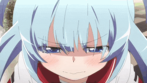 a close up of a girl with blue hair making a funny face