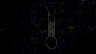 a close up of a metal object that looks like a watch