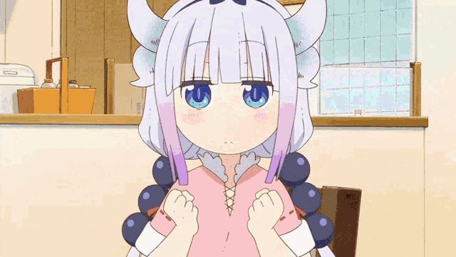 three anime characters are sitting on a couch and one of them has a tail on her back