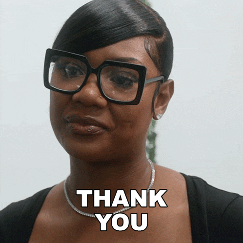 a woman wearing glasses says thank you